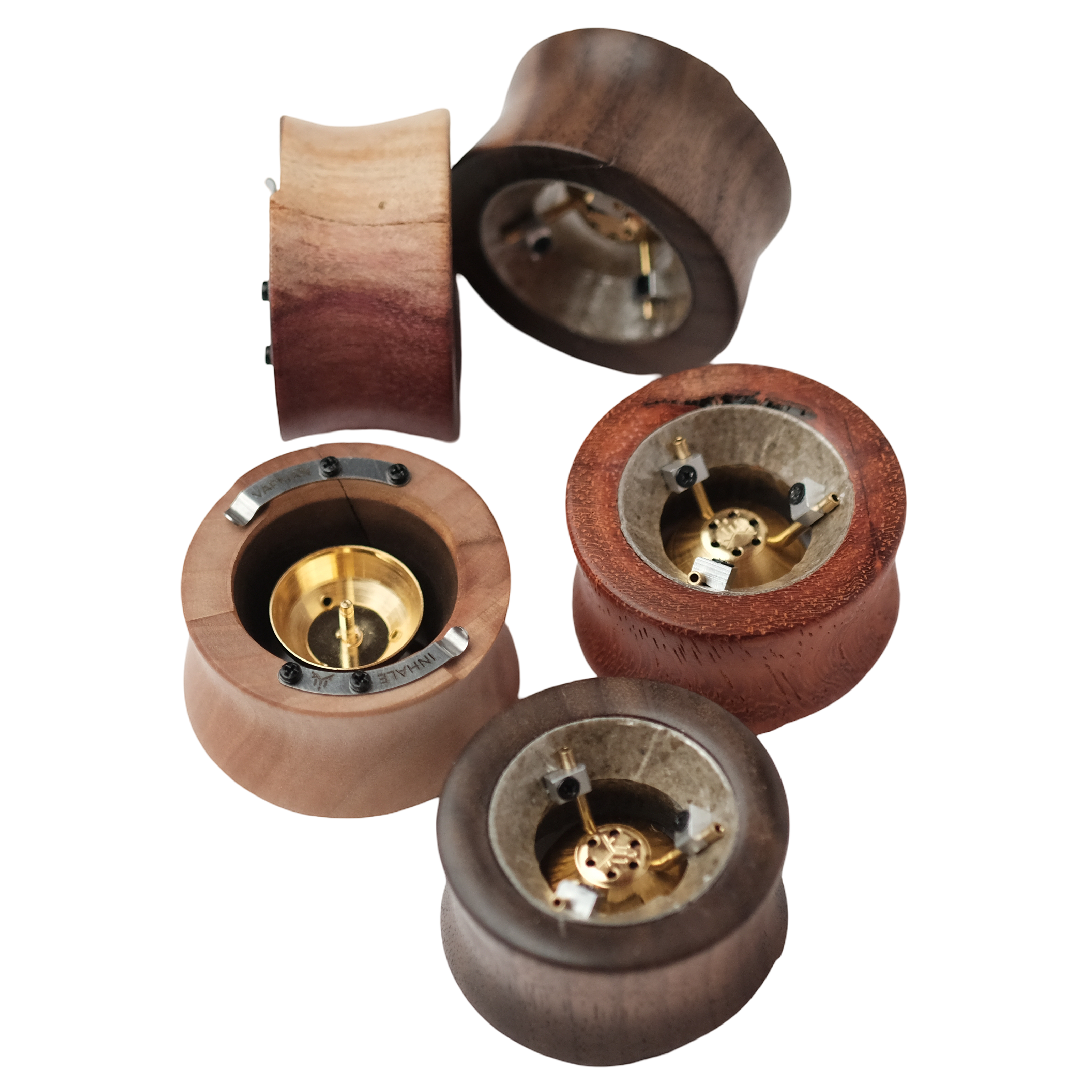 Vapman Click B-Ware vaporizers in multiple wood types — top view showing brass heating chamber and click mechanism, various wood grains including walnut, padauk and maple, transparent background